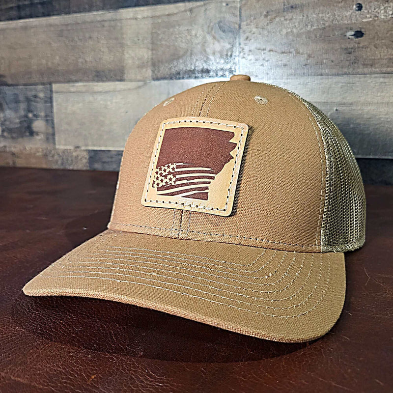 arkansas with United States flag hat in tan
